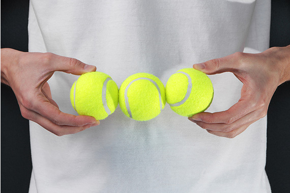 Man holding tennis balls